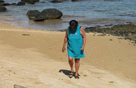 Fran searching for seashells on Tunnels Beach on the North Shore of Kauai